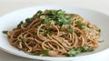 Fresh Herbed Whole Wheat Spaghetti on White Plate Royalty Free Stock Photo