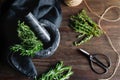 Fresh herbs in a marble mortar on a table Royalty Free Stock Photo