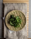 Fresh Herbs mint, cilantro, and parsley on bamboo plate on the table Royalty Free Stock Photo