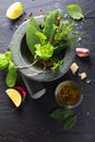 Fresh herbs in a pestle and mortar Royalty Free Stock Photo