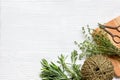 Fresh herbs preparation to be dried top view wooden background Royalty Free Stock Photo