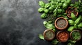 Fresh herbs and spices arranged on dark surface Royalty Free Stock Photo