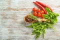 Fresh herbs with spices and vegetables on wooden background Royalty Free Stock Photo