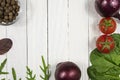 Fresh herbs and vegetables and spices on a white wooden background. Top view Royalty Free Stock Photo