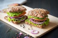 Fresh home made burgers with grain bread on wooden background Royalty Free Stock Photo