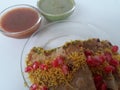 Fresh home made tortilla dabeli dish with two types of Indian chutney.