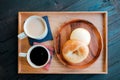Fresh Homemade Bagel Bread and Hot Coffee, Milk Tea on Wooden Tray