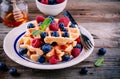 Fresh homemade belgian waffles with blueberries and raspberries for breakfast Royalty Free Stock Photo