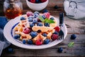 Fresh homemade belgian waffles with blueberries and raspberries for breakfast Royalty Free Stock Photo