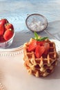 Fresh homemade belgian waffles with strawberries