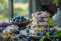 Fresh Homemade Blueberry Cookies on Rustic Wooden Table with Berries and Greenery