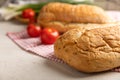 Fresh homemade bread with green onions and cherry tomatoes on a kitchen towel Royalty Free Stock Photo