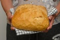 fresh homemade bread in the hands of a woman in the kitchen 5