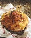 Fresh homemade bread on kitchen table close-up.