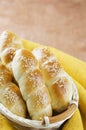 Fresh homemade bread rolls with sesam seed in basket on wooden t Royalty Free Stock Photo