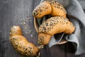 Fresh homemade bread rolls with sesam seed on table Royalty Free Stock Photo