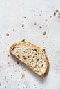 Fresh homemade bread slice from whole grain sourdough flour with the addition of bran, seeds sunflower, pumpkin, flax, sesame Royalty Free Stock Photo