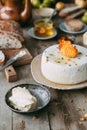 Fresh homemade cheese with dried apricot. Still life with hands, the chef prepares dishes.