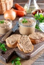 Fresh homemade chicken liver pate on bread on rustic background Royalty Free Stock Photo