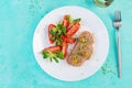 Fresh homemade chicken liver pate on bread and tomatoes salad. Royalty Free Stock Photo