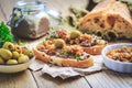 Fresh homemade chicken liver pate on ciabatta bread with roasted onions and olives Royalty Free Stock Photo