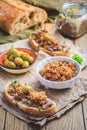 Fresh homemade chicken liver pate on ciabatta bread with roasted onions and olives Royalty Free Stock Photo