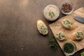 Fresh homemade chicken liver pate with greens on bread on a dark background. view from above Royalty Free Stock Photo