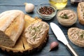 Fresh homemade chicken liver pate with herbs on bread on a blue wooden table. A sandwich Royalty Free Stock Photo