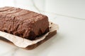 Fresh homemade chocolate sponge cake on wooden board