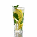 Fresh homemade cocktail in a tall glass with lemon, mint and ice isolated on white background Royalty Free Stock Photo