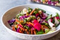 Fresh Homemade Colorful Salad with Purple Cabbage, Beet, Carrot and Rocket. Royalty Free Stock Photo