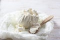 Fresh homemade cottage cheese in cheesecloth on white wooden ta Royalty Free Stock Photo