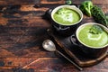 Fresh homemade cream broccoli soup in bowl . Dark Wooden background. Top view. Copy space Royalty Free Stock Photo