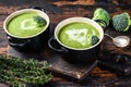 Fresh homemade cream broccoli soup in bowl . Dark Wooden background. Top view Royalty Free Stock Photo