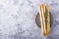 Fresh homemade crispy bread sticks with thyme and sea salt on a gray concrete background herbs. selective focus Royalty Free Stock Photo