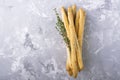 Fresh homemade crispy bread sticks with thyme and sea salt on a gray concrete background herbs. selective focus Royalty Free Stock Photo