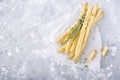 Fresh homemade crispy bread sticks with thyme and sea salt on a gray concrete background herbs. selective focus Royalty Free Stock Photo