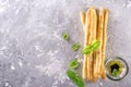 Fresh homemade crispy bread sticks with thyme and sea salt on a gray concrete background herbs Royalty Free Stock Photo