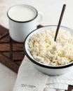 Fresh homemade crumbly cottage cheese in a bowl, farm-fresh produce. Royalty Free Stock Photo