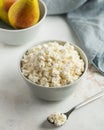 Fresh homemade crumbly cottage cheese in a bowl, farm-fresh produce. Royalty Free Stock Photo