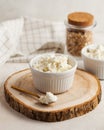 Fresh homemade crumbly cottage cheese in a bowl, farm-fresh produce. Royalty Free Stock Photo