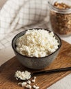 Fresh homemade crumbly cottage cheese in a bowl, farm-fresh produce. Royalty Free Stock Photo