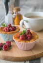 Fresh homemade delicious raspberry muffins with coffee for breakfast Royalty Free Stock Photo