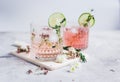 Fresh homemade drink with flowers and lime on kitchen background Royalty Free Stock Photo