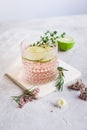 Fresh homemade drink with flowers and lime on kitchen background Royalty Free Stock Photo