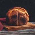 Fresh homemade loaf of bread with crispy toasted crust. Selective focus, toned