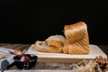 Fresh homemade loafs bread and sliced bread on cutting board with jam strawberry close up on wooden background.Healthy Diet.Prepar Royalty Free Stock Photo