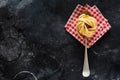 Fresh homemade pasta tagliatelle on wooden spoon with pasta ingredients tomatoes, raw egg, basil leaf on the dark concrete backgro Royalty Free Stock Photo