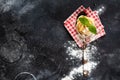 Fresh homemade pasta tagliatelle on wooden spoon with pasta ingredients tomatoes, raw egg, basil leaf on the dark concrete backgro Royalty Free Stock Photo