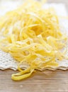 Fresh homemade pasta on wooden table Royalty Free Stock Photo
